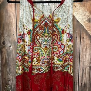 Bila sleeveless top. White with red and multi- colored design. Size small.